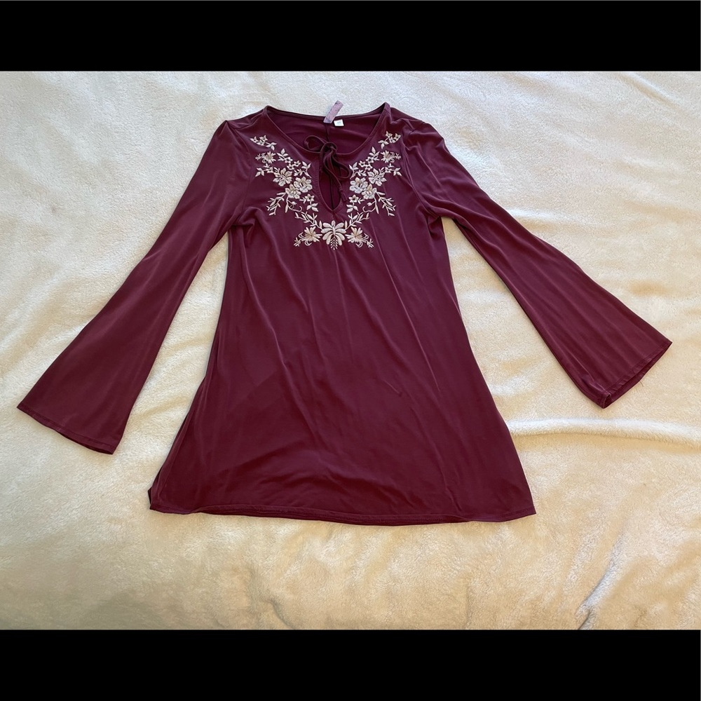 Maroon dress with white lace detailing and tie front, and flare sleeve’s